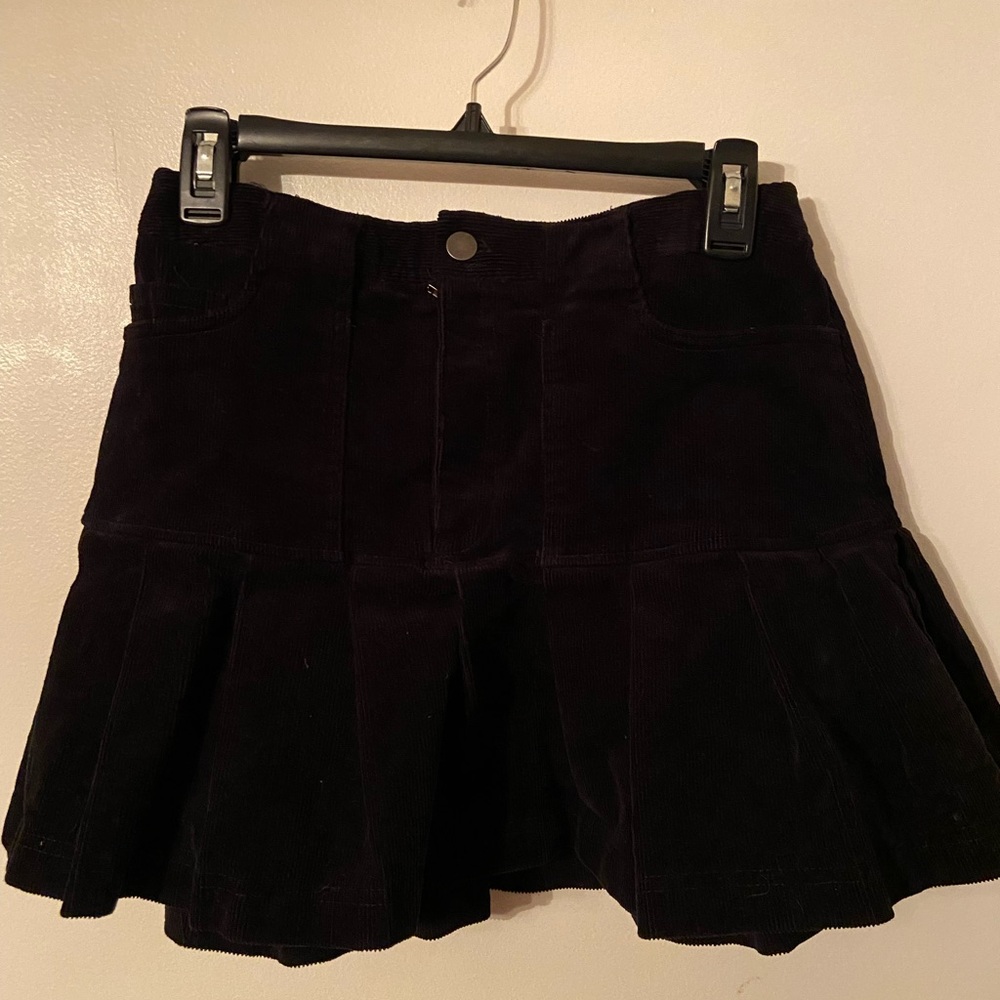 Pleated black corduroy skirt